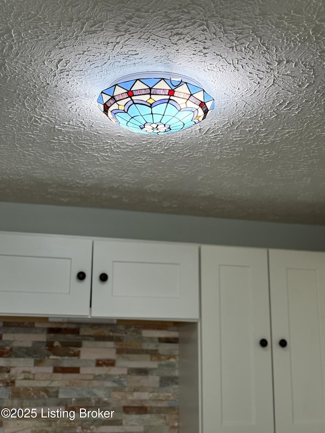 11902 Queen Annes Ct, Louisville, KY 40245 - kitchen view of white cabinetry and a textured ceiling