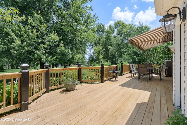 11731 Paramont Way, Prospect, KY 40059 - wooden deck with outdoor dining area and view of wooded area