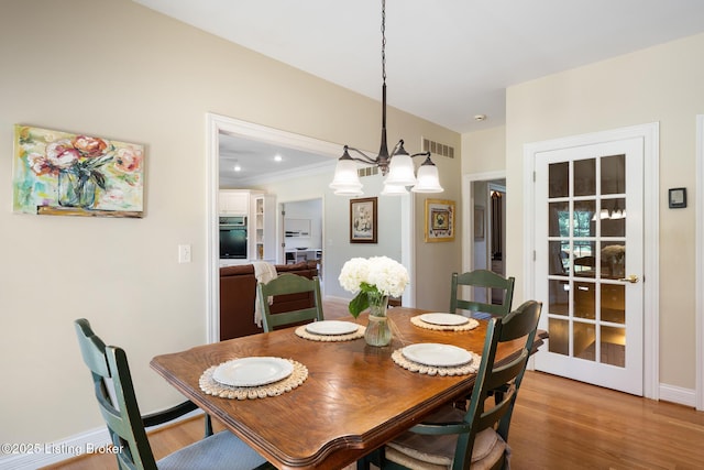 11731 Paramont Way, Prospect, KY 40059 - dining room with a chandelier and light wood-style floors