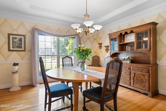 11731 Paramont Way, Prospect, KY 40059 - dining room with a chandelier, wallpapered walls, light wood-style floors, and ornamental molding