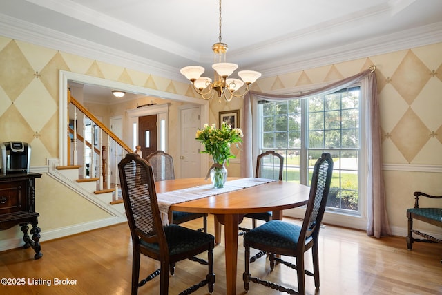 11731 Paramont Way, Prospect, KY 40059 - dining room featuring a chandelier, crown molding, light wood-style floors, wallpapered walls, and stairs