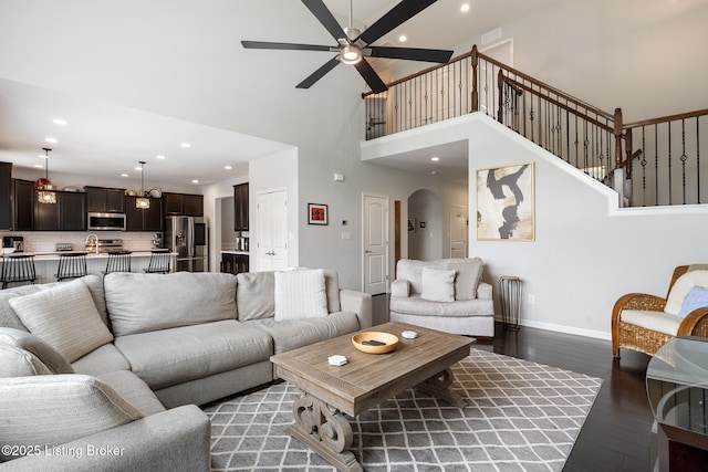 18007 Ellerslie Dr, Louisville, KY 40245 - living area with recessed lighting, arched walkways, light wood-style flooring, ceiling fan, and a towering ceiling