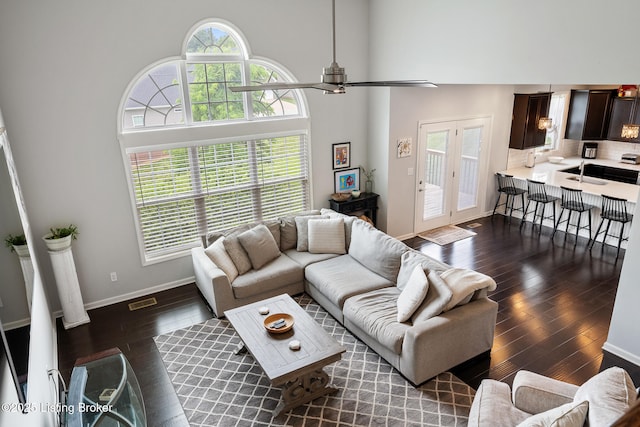 18007 Ellerslie Dr, Louisville, KY 40245 - living room with dark wood-style floors, a towering ceiling, and ceiling fan