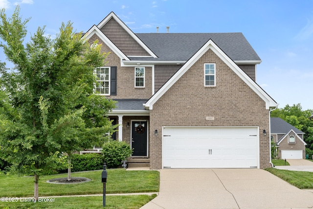 18007 Ellerslie Dr, Louisville, KY 40245 - craftsman-style home featuring concrete driveway, an attached garage, a front lawn, and brick siding