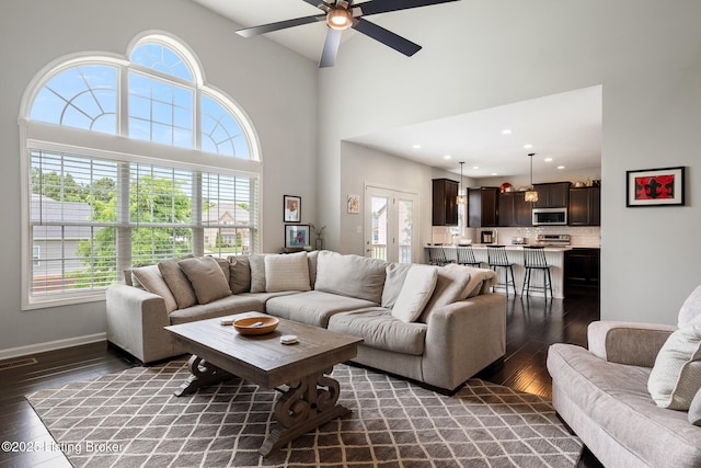 18007 Ellerslie Dr, Louisville, KY 40245 - living area featuring dark wood-type flooring, ceiling fan, a towering ceiling, and recessed lighting