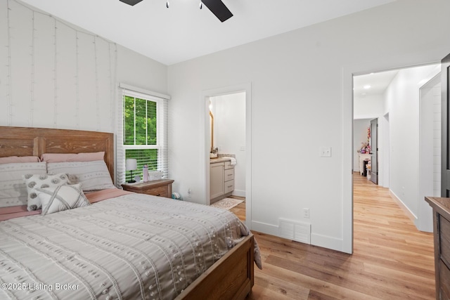 2070 Tonieville Rd, Hodgenville, KY 42748 - bedroom featuring light wood finished floors, ensuite bath, and a ceiling fan