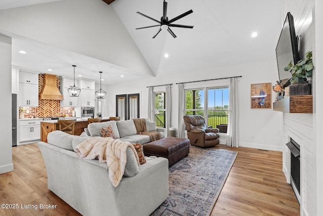2070 Tonieville Rd, Hodgenville, KY 42748 - living area with a fireplace, recessed lighting, ceiling fan, high vaulted ceiling, and light wood finished floors