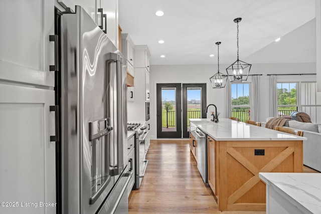2070 Tonieville Rd, Hodgenville, KY 42748 - kitchen with stainless steel appliances, light wood-style floors, recessed lighting, an island with sink, and decorative light fixtures