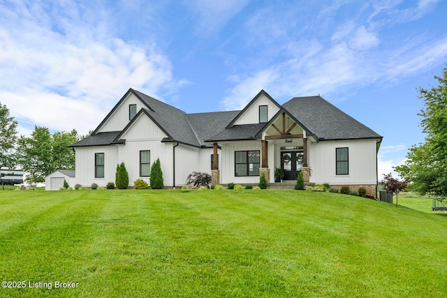 2070 Tonieville Rd, Hodgenville, KY 42748 - modern farmhouse style home with a front yard, board and batten siding, roof with shingles, and french doors