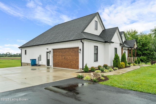 2070 Tonieville Rd, Hodgenville, KY 42748 - view of property exterior featuring a shingled roof, driveway, an attached garage, and a lawn
