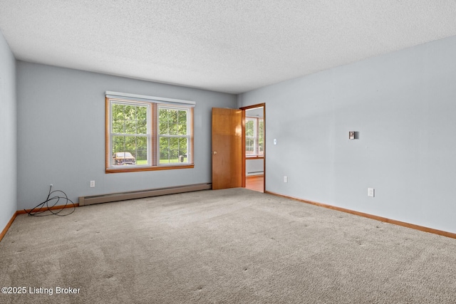 85 Joseph Ave, Cecilia, KY 42724 - carpeted spare room with baseboard heating, a textured ceiling, and a baseboard heating unit