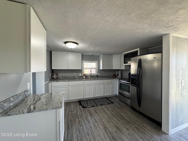2130 Rabbit Run Rd, Vine Grove, KY 40175 - kitchen featuring appliances with stainless steel finishes, a textured ceiling, white cabinetry, open shelves, and dark wood finished floors