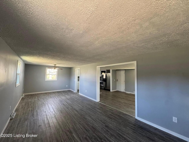 2130 Rabbit Run Rd, Vine Grove, KY 40175 - unfurnished room featuring a textured ceiling and dark wood-style flooring