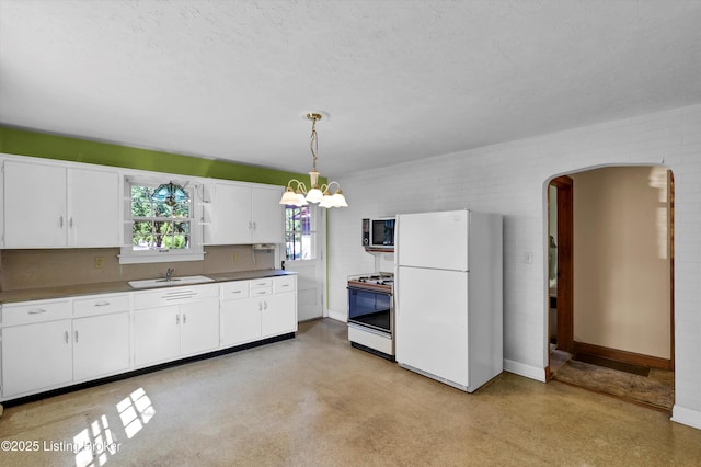 3010 Meade Ave, Louisville, KY 40217 - kitchen with white appliances, white cabinetry, decorative light fixtures, arched walkways, and a textured ceiling