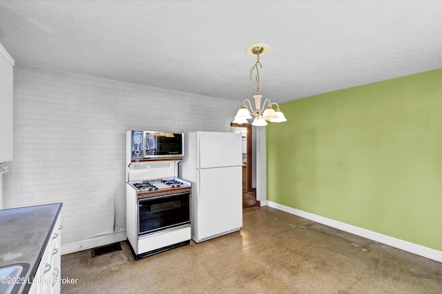3010 Meade Ave, Louisville, KY 40217 - kitchen with white appliances, a chandelier, white cabinets, pendant lighting, and brick wall