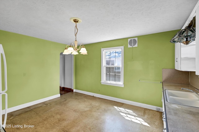 3010 Meade Ave, Louisville, KY 40217 - unfurnished dining area with a chandelier and a textured ceiling