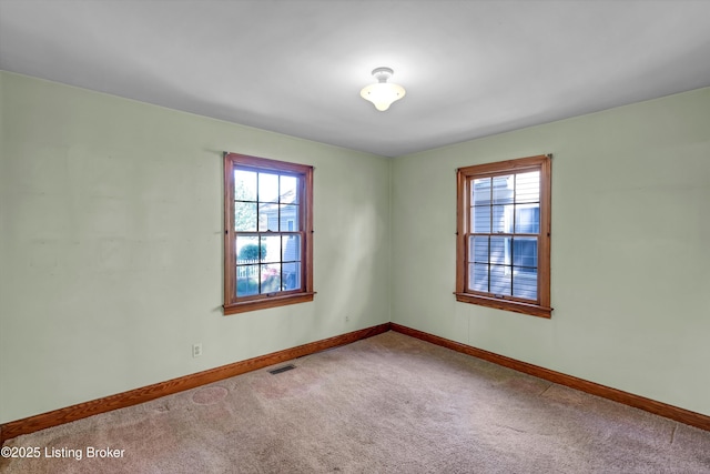 3010 Meade Ave, Louisville, KY 40217 - carpeted empty room featuring healthy amount of natural light