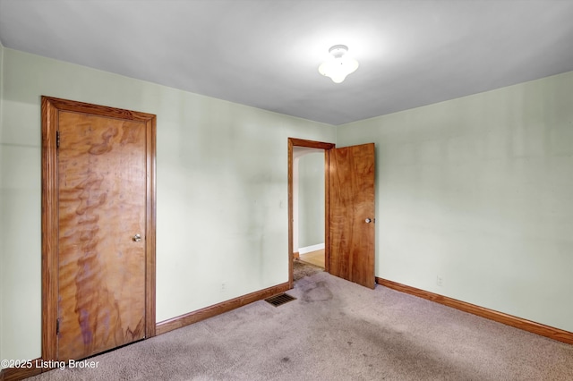 3010 Meade Ave, Louisville, KY 40217 - empty room featuring carpet flooring and baseboards