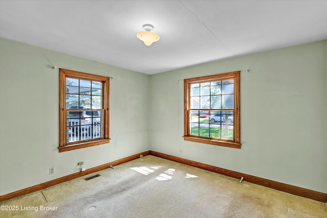 3010 Meade Ave, Louisville, KY 40217 - carpeted spare room with healthy amount of natural light