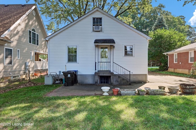 3010 Meade Ave, Louisville, KY 40217 - rear view of house featuring a lawn and a patio