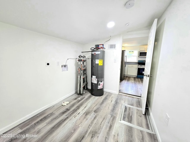 6910 Sylvania 4 Rd, Louisville, KY 40258 - utility room featuring electric water heater