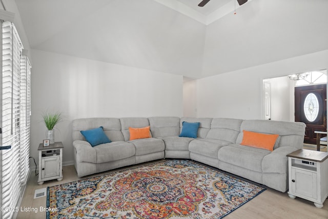 5613 Grandel Blvd, Louisville, KY 40258 - living room featuring light wood finished floors, a ceiling fan, a chandelier, and high vaulted ceiling