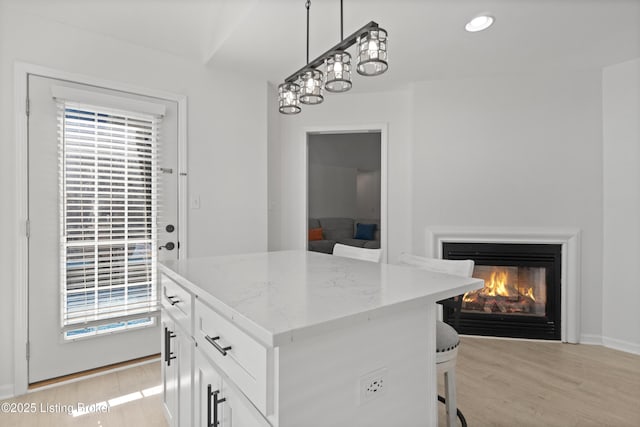 5613 Grandel Blvd, Louisville, KY 40258 - walk in closet featuring light wood finished floors and a glass covered fireplace