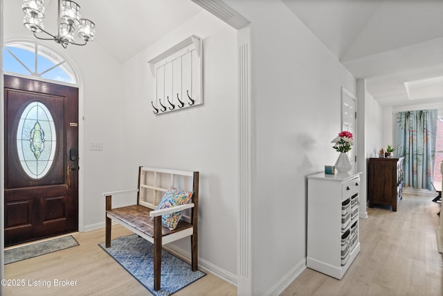 5613 Grandel Blvd, Louisville, KY 40258 - entryway with light wood finished floors, a chandelier, and vaulted ceiling