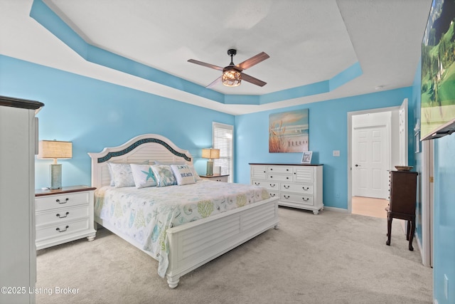 5613 Grandel Blvd, Louisville, KY 40258 - bedroom with a tray ceiling, carpet flooring, and a ceiling fan