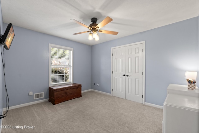 5613 Grandel Blvd, Louisville, KY 40258 - unfurnished bedroom featuring carpet, a closet, and a ceiling fan