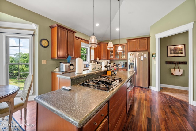1126 Lagrange Rd, New Castle, KY 40050 - kitchen with appliances with stainless steel finishes, a center island, dark wood finished floors, brown cabinetry, and lofted ceiling