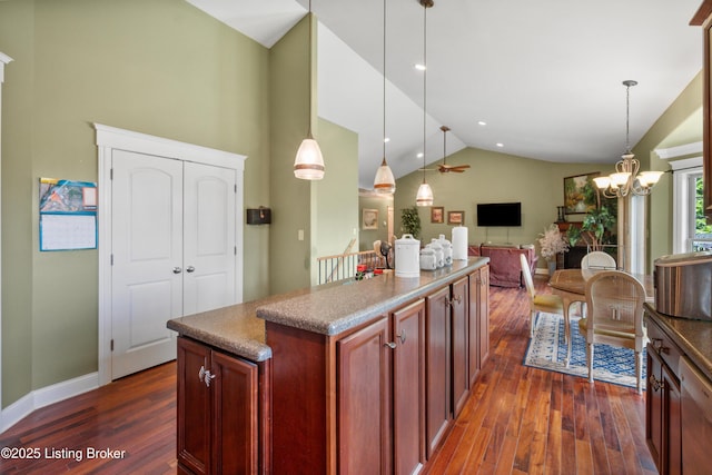 1126 Lagrange Rd, New Castle, KY 40050 - kitchen with dark wood-style flooring, hanging light fixtures, a kitchen island, open floor plan, and high vaulted ceiling