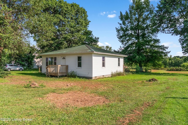 1255 Holy Cross Rd, Loretto, KY 40037 - view of property exterior featuring crawl space, a metal roof, a yard, and a deck