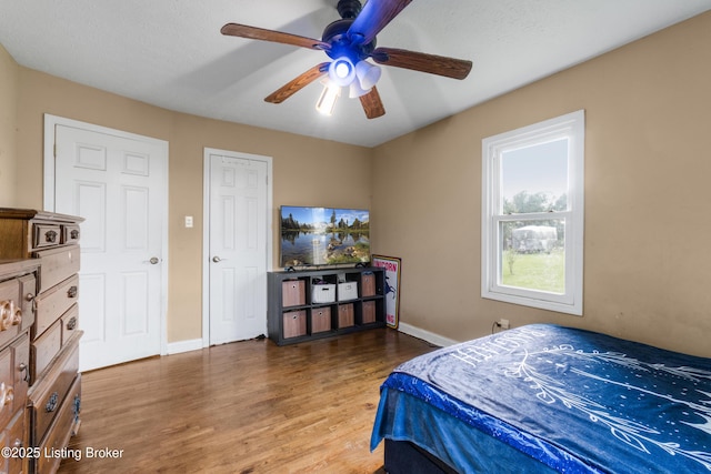 1255 Holy Cross Rd, Loretto, KY 40037 - bedroom with wood finished floors and ceiling fan