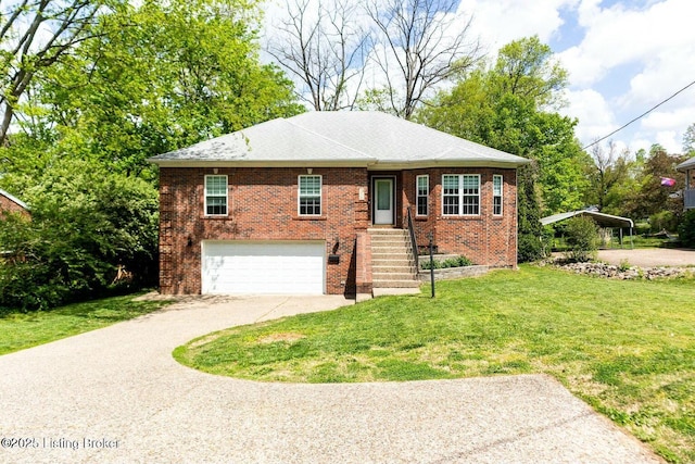 9829 Galene Dr, Jeffersontown, KY 40299 - view of front of home with concrete driveway, a garage, brick siding, and a front yard