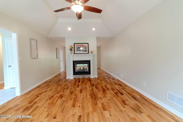 9829 Galene Dr, Jeffersontown, KY 40299 - unfurnished living room with ornamental molding, a ceiling fan, a multi sided fireplace, light wood-style floors, and lofted ceiling