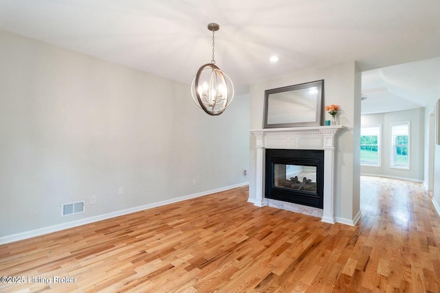 9829 Galene Dr, Jeffersontown, KY 40299 - unfurnished living room with light wood finished floors, a chandelier, a multi sided fireplace, and recessed lighting