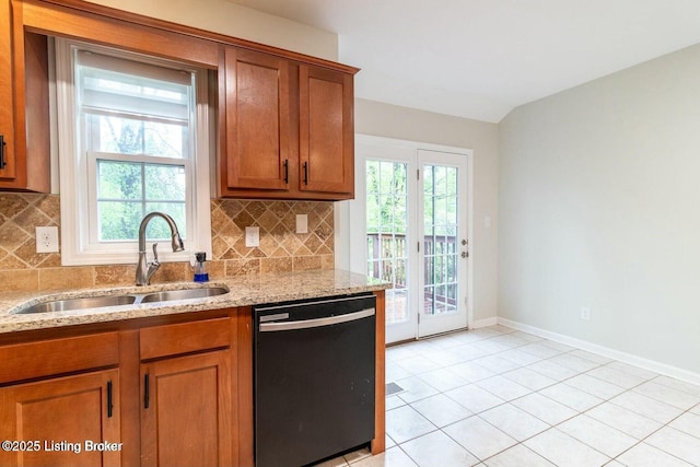 9829 Galene Dr, Jeffersontown, KY 40299 - kitchen with black dishwasher, brown cabinetry, backsplash, and light stone countertops