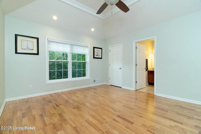 9829 Galene Dr, Jeffersontown, KY 40299 - unfurnished bedroom featuring light wood finished floors, recessed lighting, a tray ceiling, connected bathroom, and ceiling fan