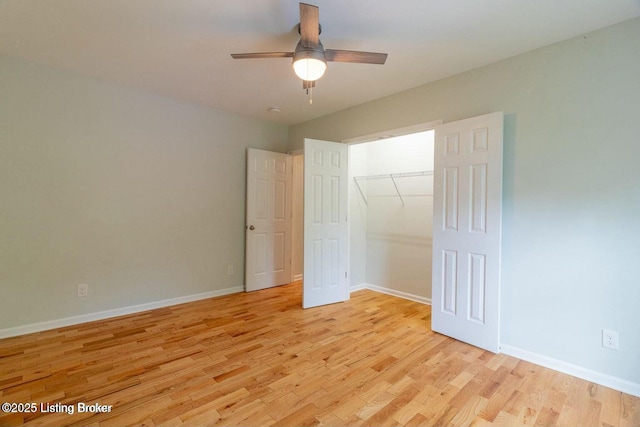 9829 Galene Dr, Jeffersontown, KY 40299 - unfurnished bedroom with light wood-style flooring, a closet, and a ceiling fan