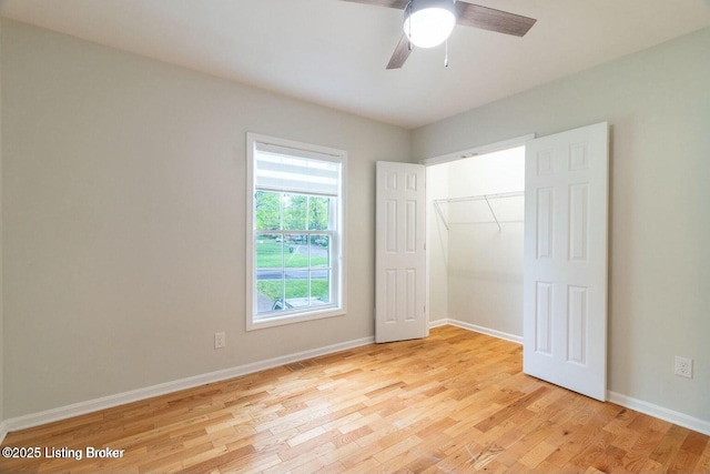9829 Galene Dr, Jeffersontown, KY 40299 - unfurnished bedroom featuring light wood-style floors, a closet, and a ceiling fan