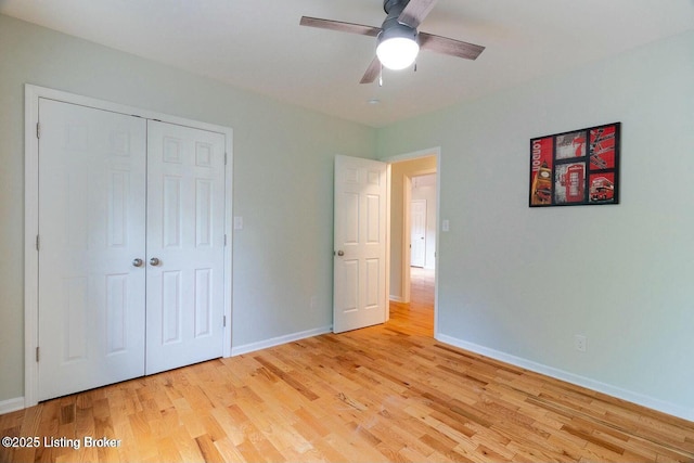 9829 Galene Dr, Jeffersontown, KY 40299 - unfurnished bedroom with light wood finished floors, a closet, and a ceiling fan