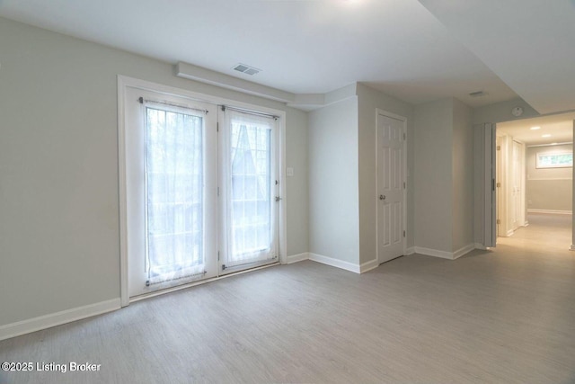 9829 Galene Dr, Jeffersontown, KY 40299 - spare room featuring wood finished floors and healthy amount of natural light