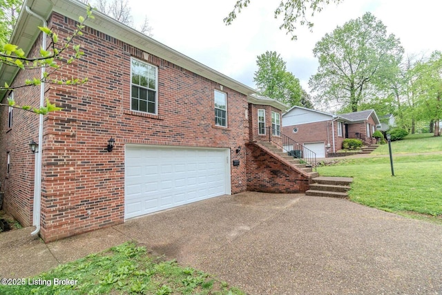 9829 Galene Dr, Jeffersontown, KY 40299 - view of property exterior featuring concrete driveway, a garage, brick siding, and a lawn