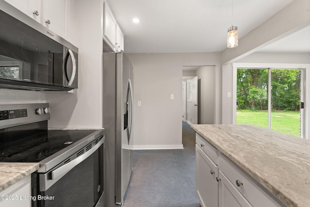 9715 Shady Acres Ln, Jeffersontown, KY 40299 - kitchen featuring appliances with stainless steel finishes, white cabinets, light stone countertops, hanging light fixtures, and dark colored carpet