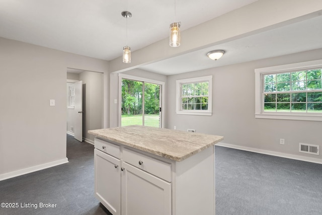 9715 Shady Acres Ln, Jeffersontown, KY 40299 - kitchen with dark carpet, white cabinets, pendant lighting, and a center island