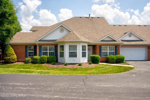 6813 Casey Pl, Louisville, KY 40229 - view of front of house with brick siding, driveway, a shingled roof, and an attached garage