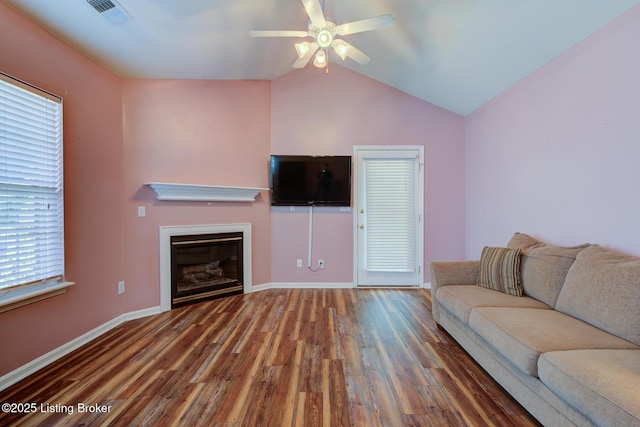 6813 Casey Pl, Louisville, KY 40229 - living room featuring wood finished floors, a ceiling fan, a glass covered fireplace, and lofted ceiling