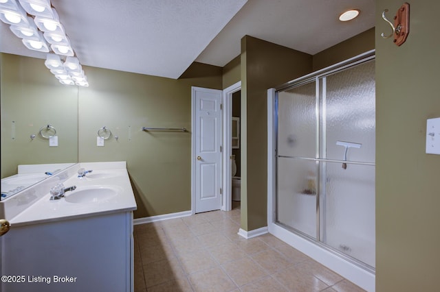 6813 Casey Pl, Louisville, KY 40229 - bathroom featuring tile patterned flooring, double vanity, and a shower stall