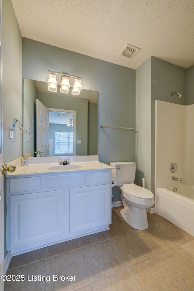 6813 Casey Pl, Louisville, KY 40229 - full bath with tile patterned floors, vanity,  shower combination, and a textured ceiling